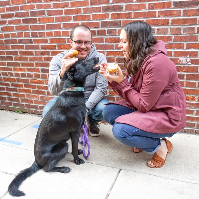 Daugherty and husband, Rob giving a dog a dog treat