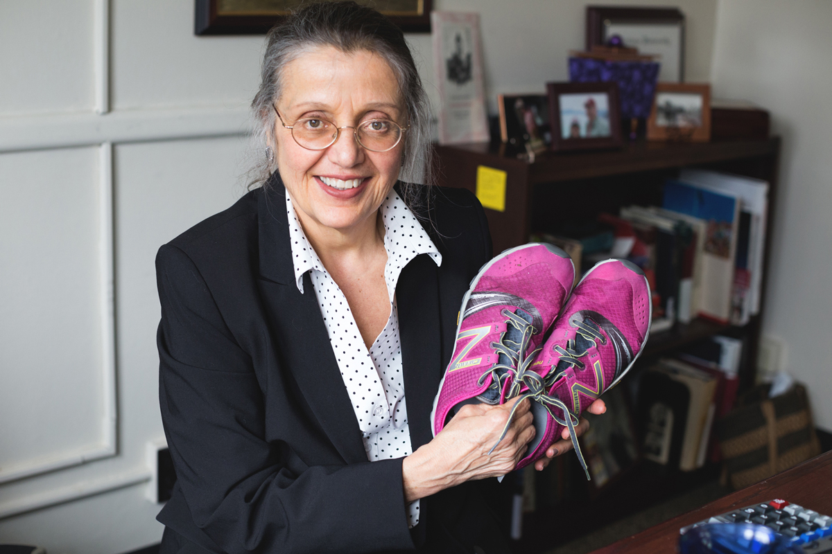 Linda holding pink sneakers