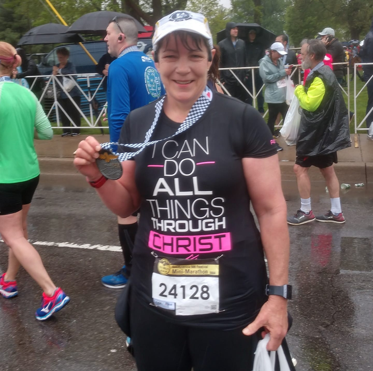 Lynne with a medal at a marathon